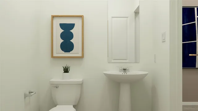 a bathroom with a sink and mirror with toilet