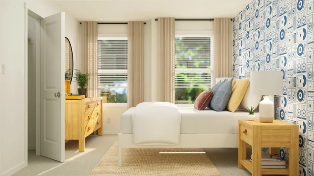 a bedroom with a bed and a couch