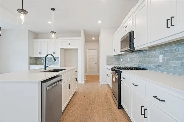 $479,950 | 409 Woodview Drive, Raymore, MO 64083