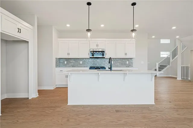 $479,950 | 409 Woodview Drive, Raymore, MO 64083