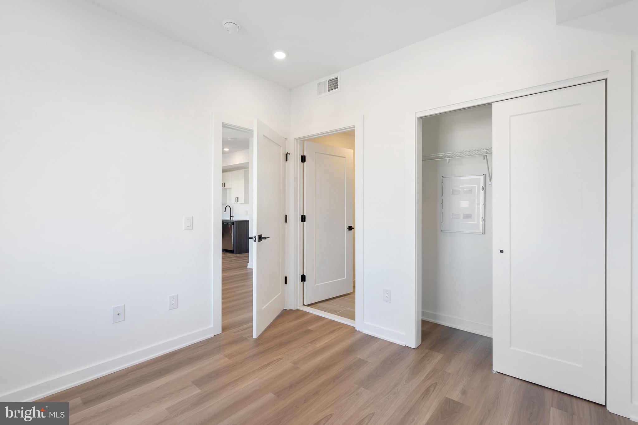2111 North Front Street, Unit 204 Philadelphia, PA 19122 - Photo 6 of 13 a view of an empty room with wooden floor