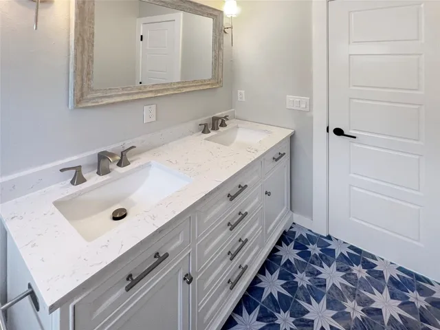 a bathroom with a sink and a mirror