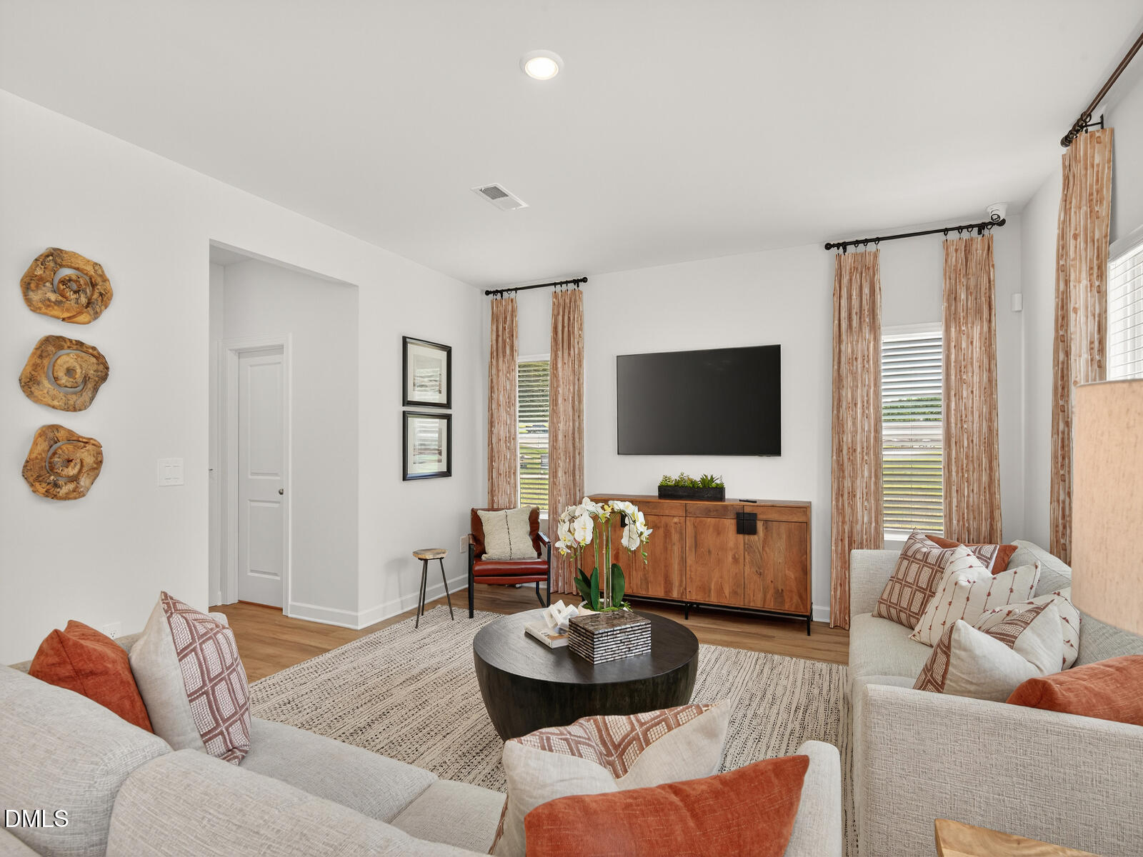 62 Thistle Patch Place Angier, NC 27501 - Photo 11 of 22 a living room with furniture and a flat screen tv