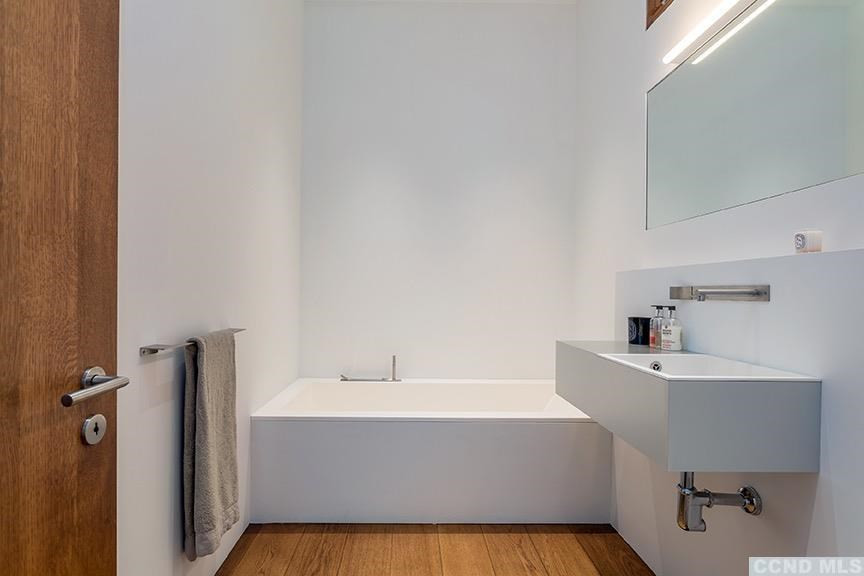 708 New Forge Rd II Taghkanic, NY 12502 - Photo 12 of 29 a bathroom with a tub sink and mirror