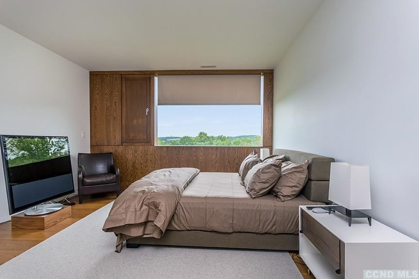 708 New Forge Rd II Taghkanic, NY 12502 - Photo 17 of 29 a bedroom with a bed and a window