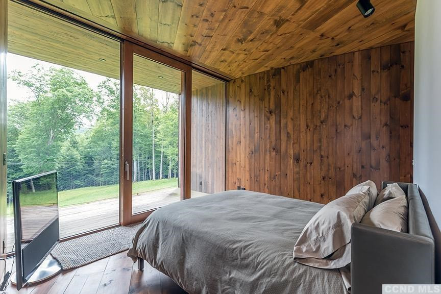 708 New Forge Rd II Taghkanic, NY 12502 - Photo 23 of 29 a bed sitting in a bedroom next to a window