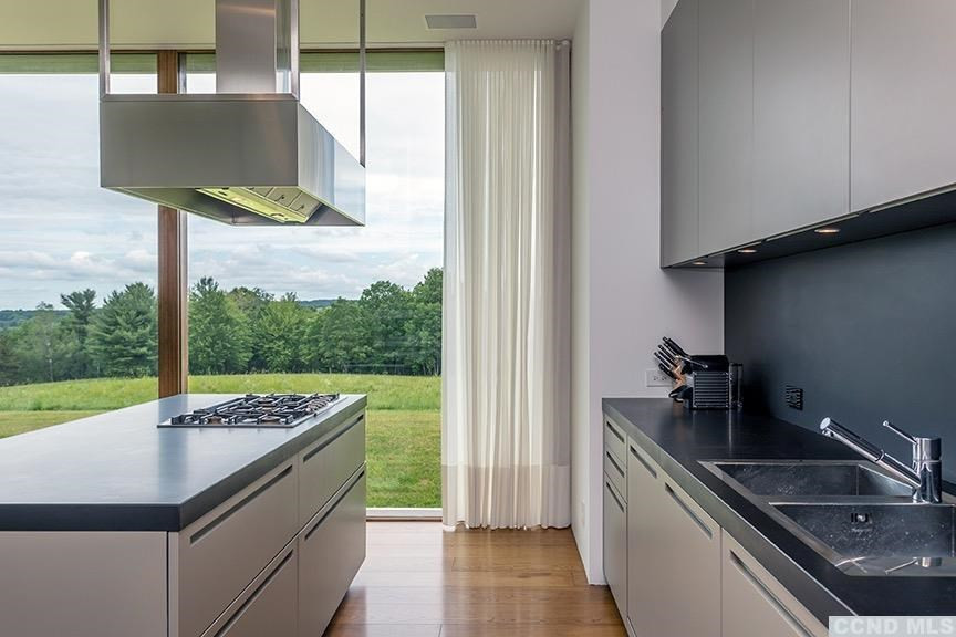 708 New Forge Rd II Taghkanic, NY 12502 - Photo 7 of 29 a kitchen that has a sink and a stove