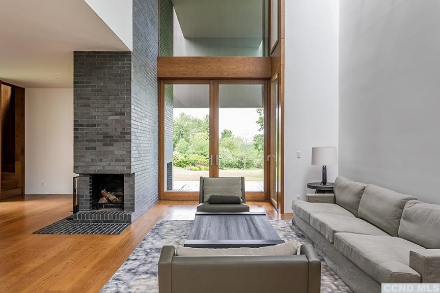708 New Forge Rd II Taghkanic, NY 12502 - Photo 9 of 29 a living room with furniture and a fireplace