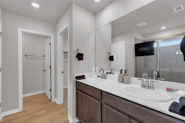 a bedroom with a bed and a tv