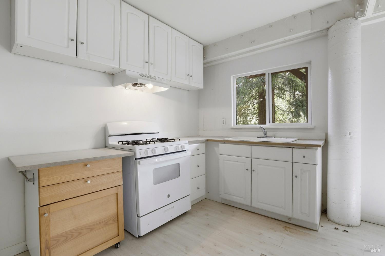 10 Pedrini Way Lagunitas, CA 94938 - Photo 16 of 31 a kitchen with white cabinets and white appliances