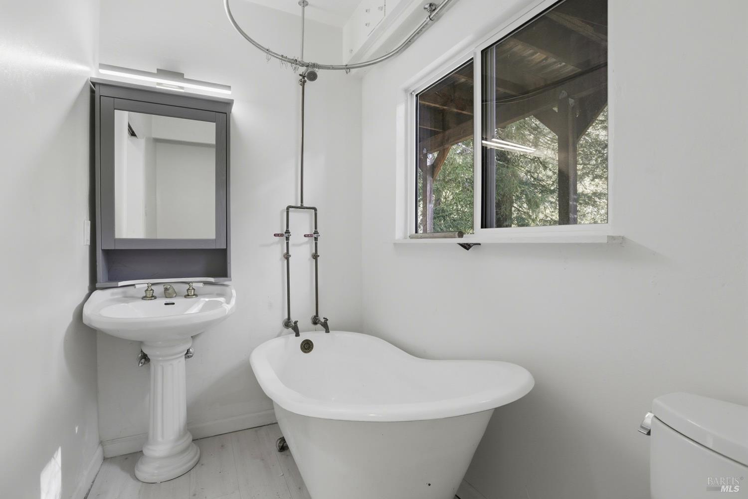 10 Pedrini Way Lagunitas, CA 94938 - Photo 20 of 31 a bathroom with a sink and mirror with toilet