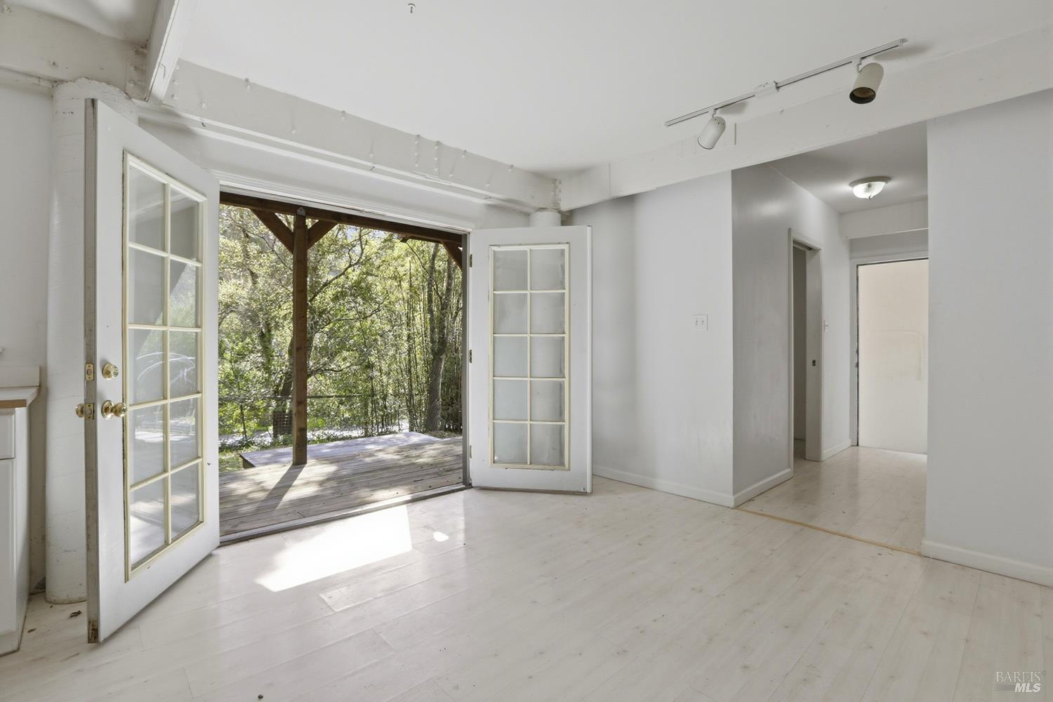 10 Pedrini Way Lagunitas, CA 94938 - Photo 24 of 31 a view of an empty room with wooden floor and a sliding door