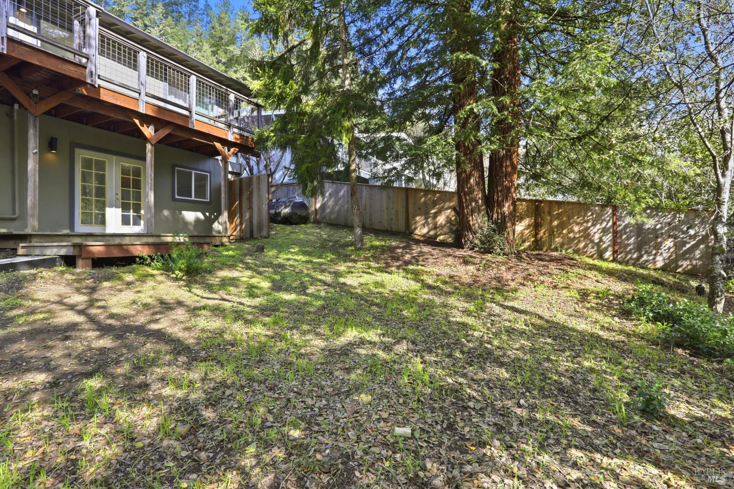 10 Pedrini Way Lagunitas, CA 94938 - Photo 29 of 31 a backyard of a house with table and chairs