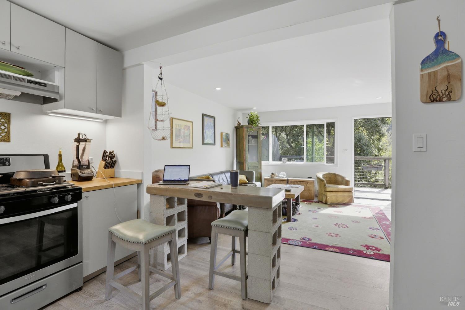 10 Pedrini Way Lagunitas, CA 94938 - Photo 8 of 31 a kitchen with a stove a sink a dining table and chairs