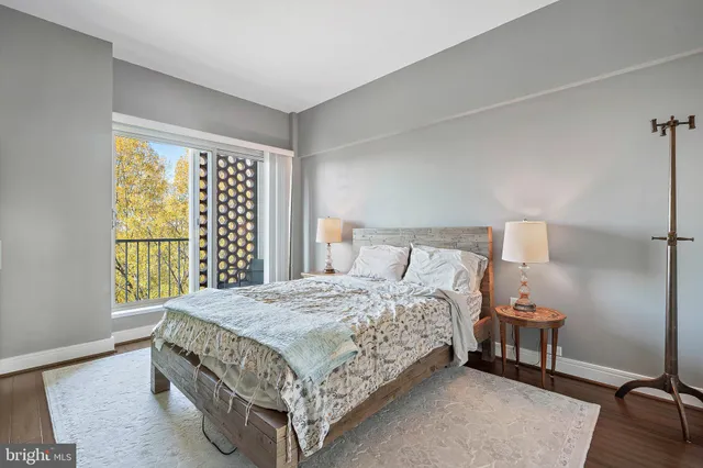 a bedroom with a bed and a cabinets