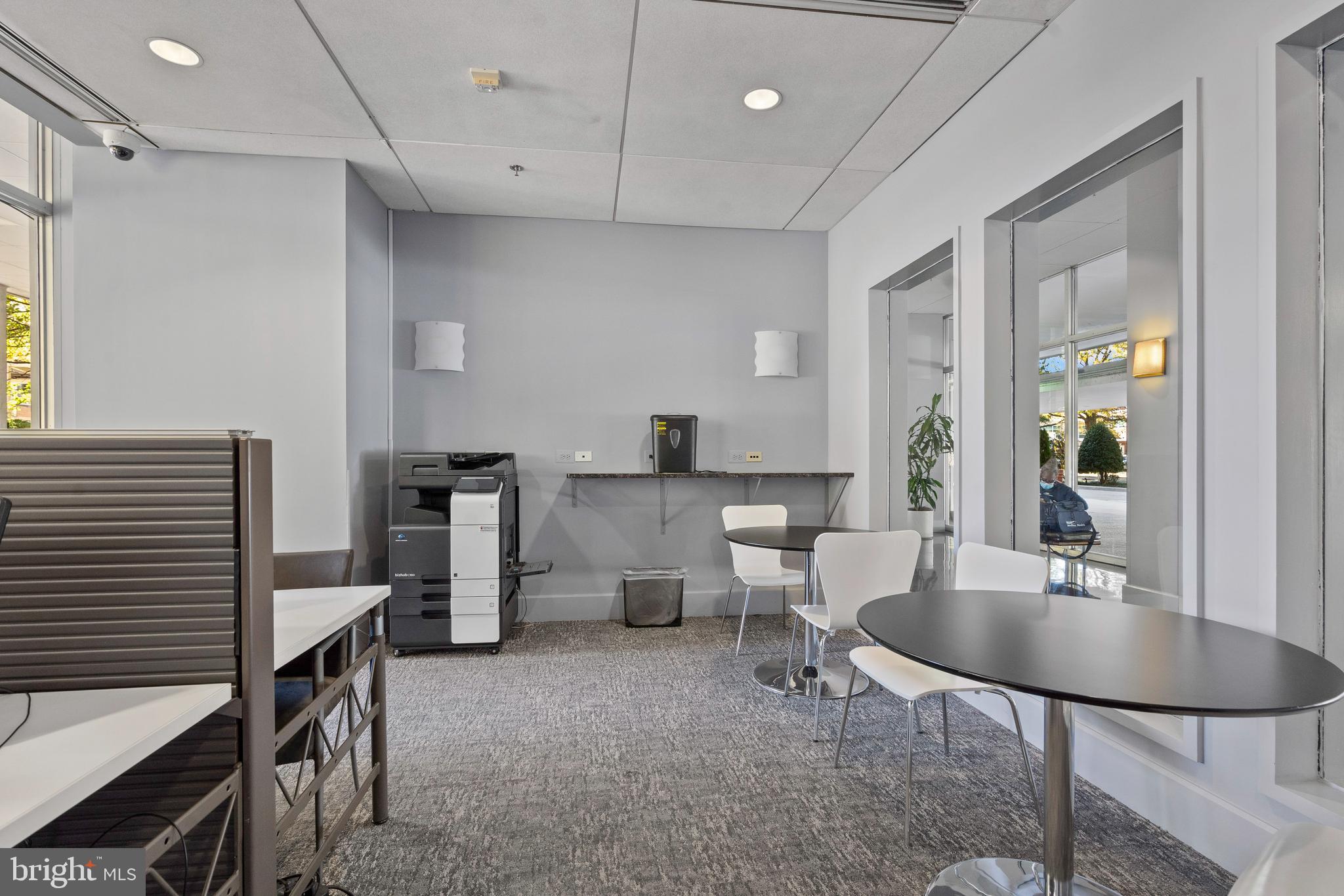 800 4th Street Southwest, Unit N801 Washington, DC 20024 - Photo 22 of 31 a kitchen with a table chairs and refrigerator