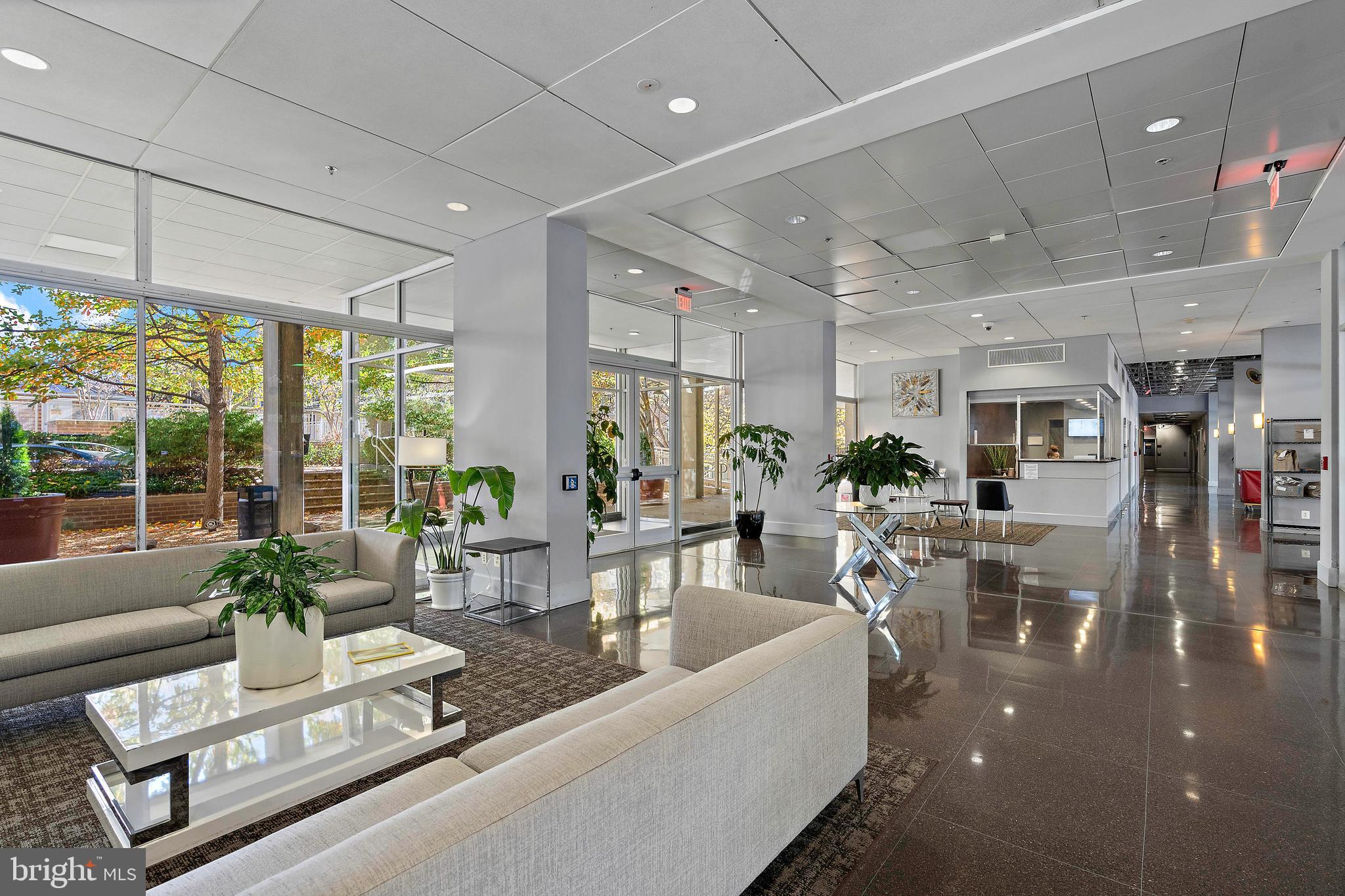 800 4th Street Southwest, Unit N801 Washington, DC 20024 - Photo 23 of 31 a living room with furniture and a large window