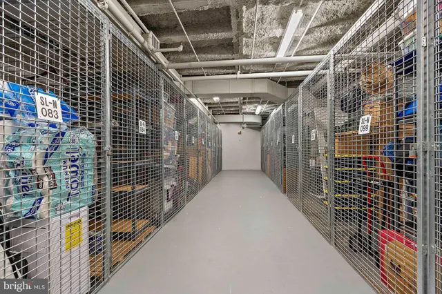 a building with car parked on the side of road