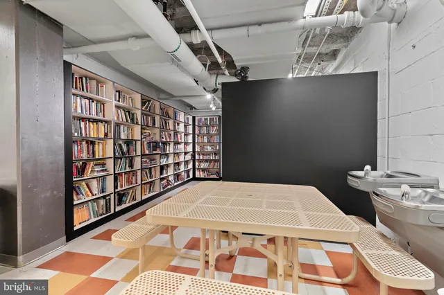 a view of a brick building next to a yard