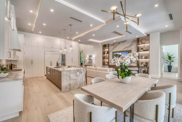 a large kitchen with stainless steel appliances kitchen island granite countertop a lot of counter space and cabinets