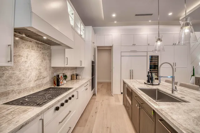 a view of a patio with a dining table and chairs with wooden floor