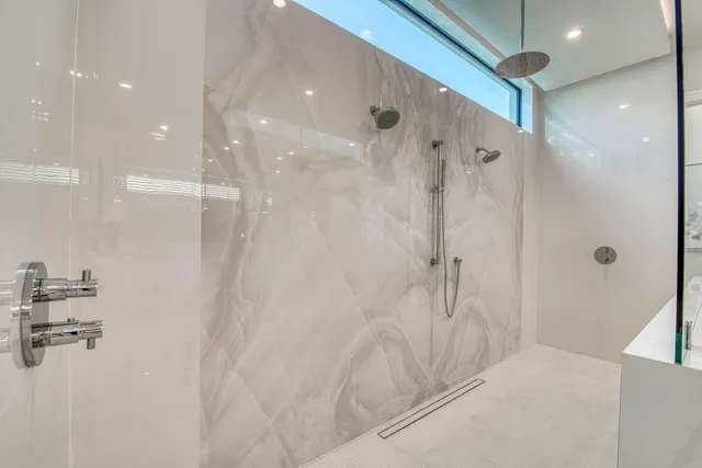 a view of a room with wooden floor and a window