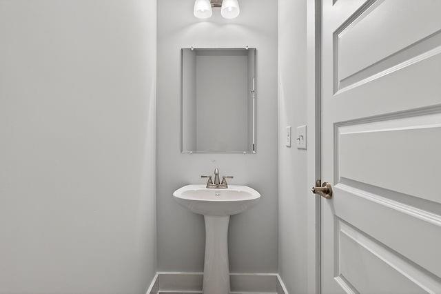 2562 Harbor Ridge Pass Gainesville, GA 30507 - Photo 10 of 27 a bathroom with a sink and a mirror