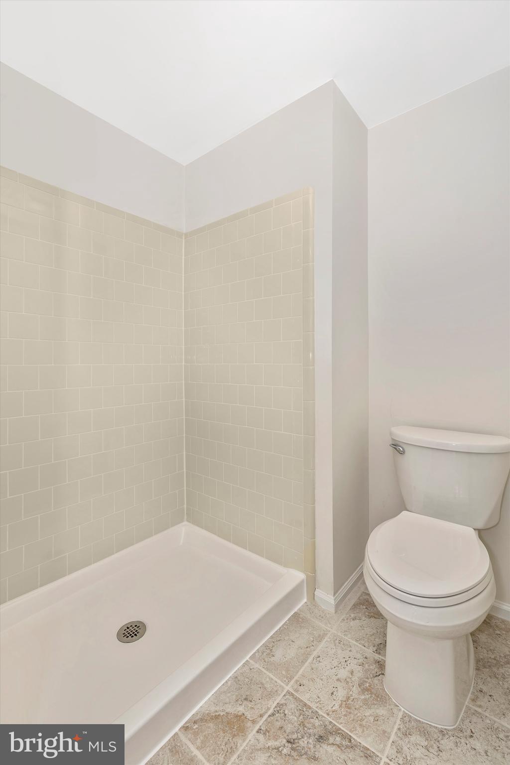 8001 Hollow Reed Court Frederick, MD 21701 - Photo 24 of 33 a bathroom with a toilet and a tub