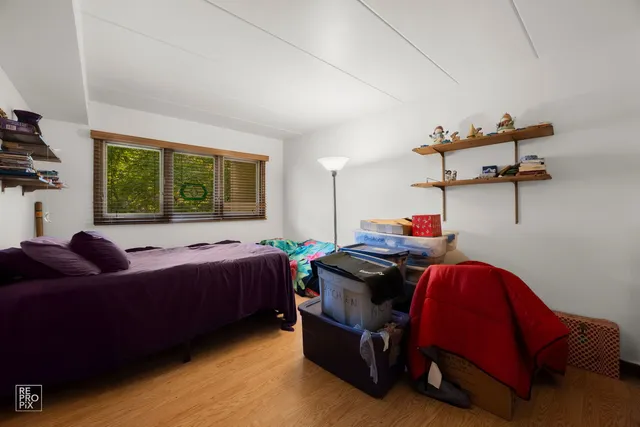 a bed room with a bed and a window