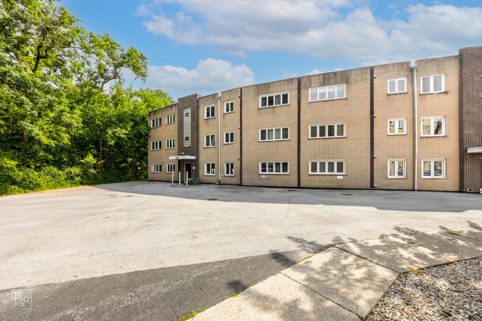 8604 West 95th Street, Unit 102 Hickory Hills, IL 60457 - Photo 10 of 10 a view of a building with many windows