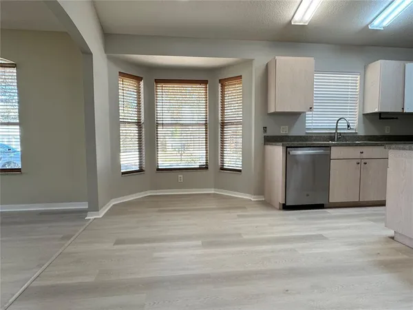 a view of a kitchen with granite countertop cabinets and a sink