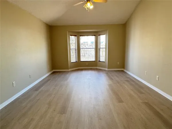 a view of room with window and hardwood floor