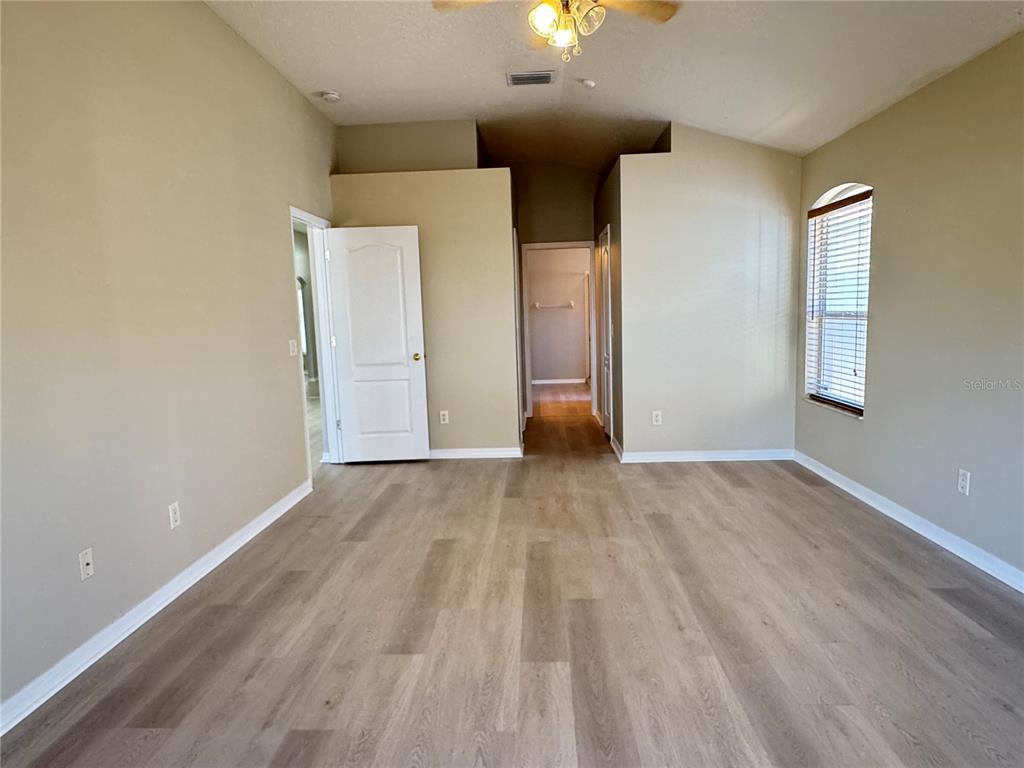 1414 Trail Boss Lane Brandon, FL 33511 - Photo 24 of 37 wooden floor in an empty room with a window