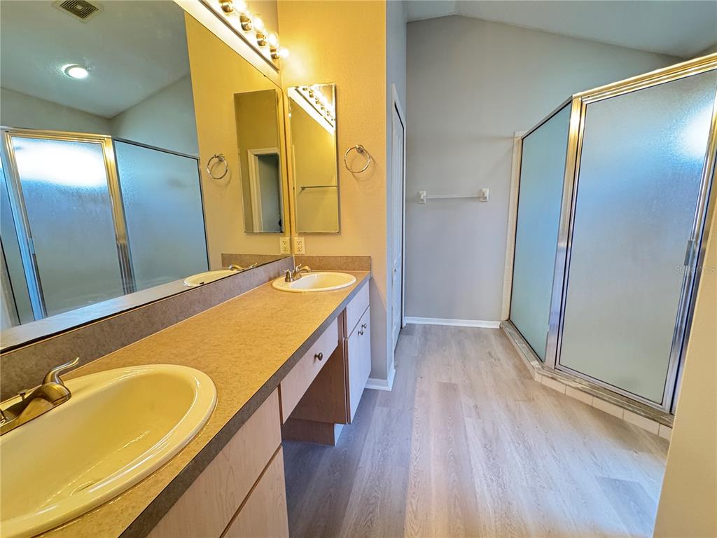 1414 Trail Boss Lane Brandon, FL 33511 - Photo 27 of 37 a bathroom with a granite countertop sink and a mirror