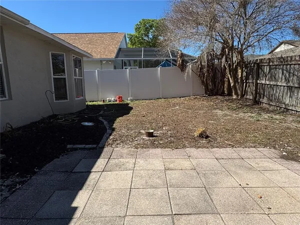 a view of a backyard of the house