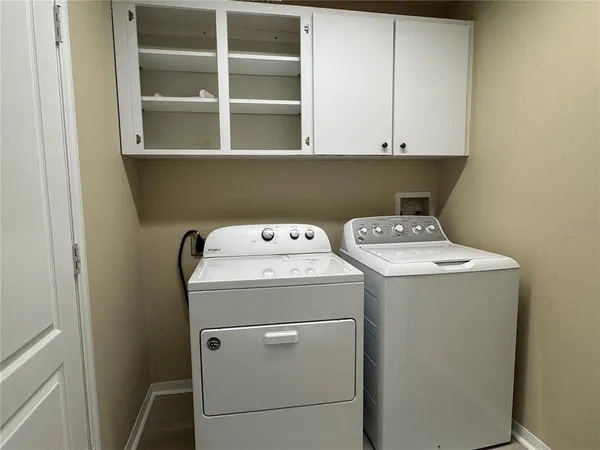 a utility room with dryer and washer