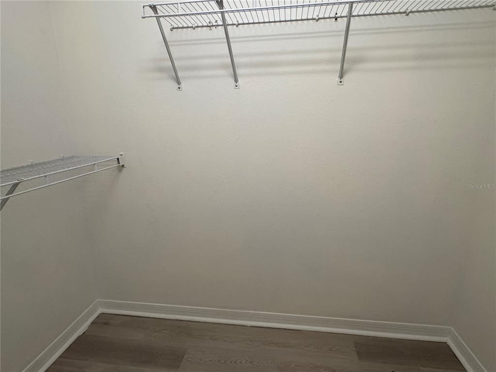 1414 Trail Boss Lane Brandon, FL 33511 - Photo 35 of 37 a view of small space with racks on the wall