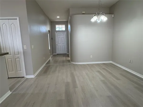 an empty room with wooden floor