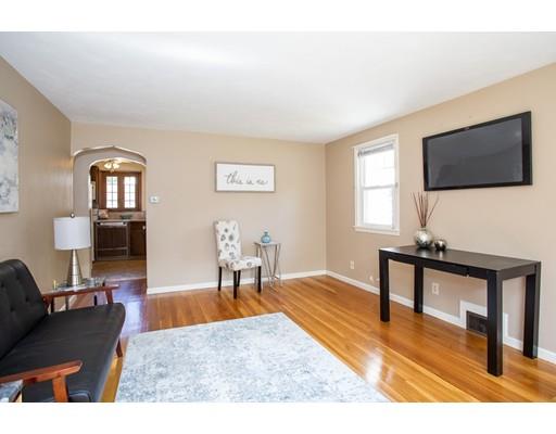 501 Granby Road Chicopee, MA 01013 - Photo 13 of 26 a living room with furniture a flat screen tv and a window