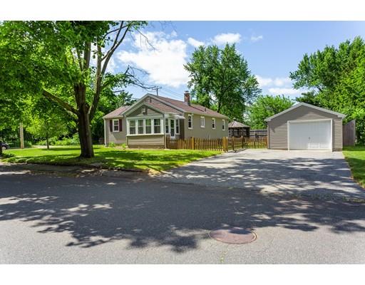 501 Granby Road Chicopee, MA 01013 - Photo 3 of 26 a front view of a house with a yard and garage