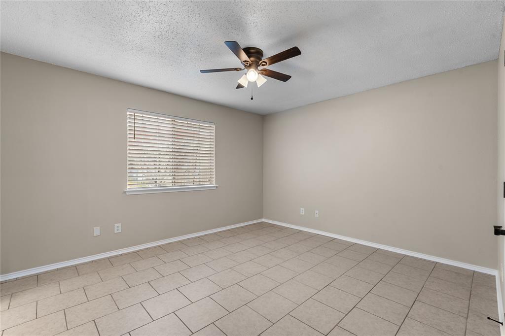 1035 North Ravinia Drive Dallas, TX 75211 - Photo 13 of 20 a view of an empty room with a window