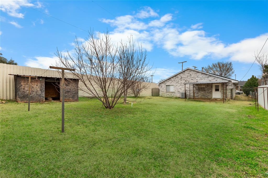 1035 North Ravinia Drive Dallas, TX 75211 - Photo 20 of 20 a front view of house with yard and green space