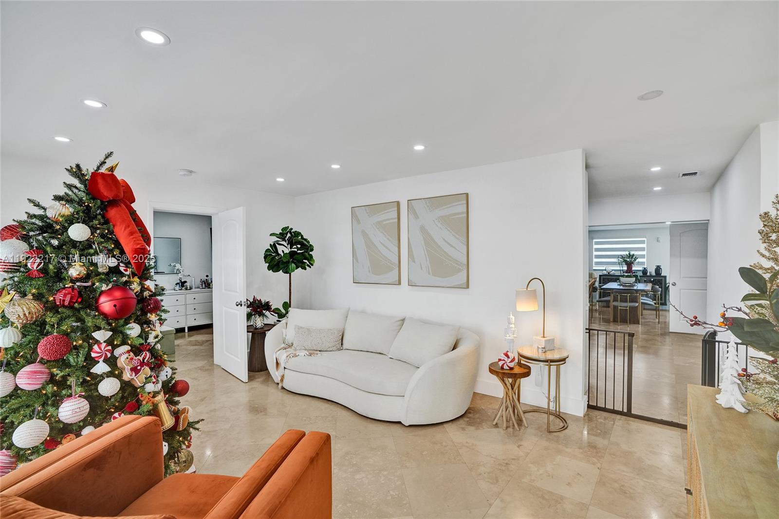 10401 Southwest 53rd Street Miami, FL 33165 - Photo 14 of 50 a living room with furniture and flowers