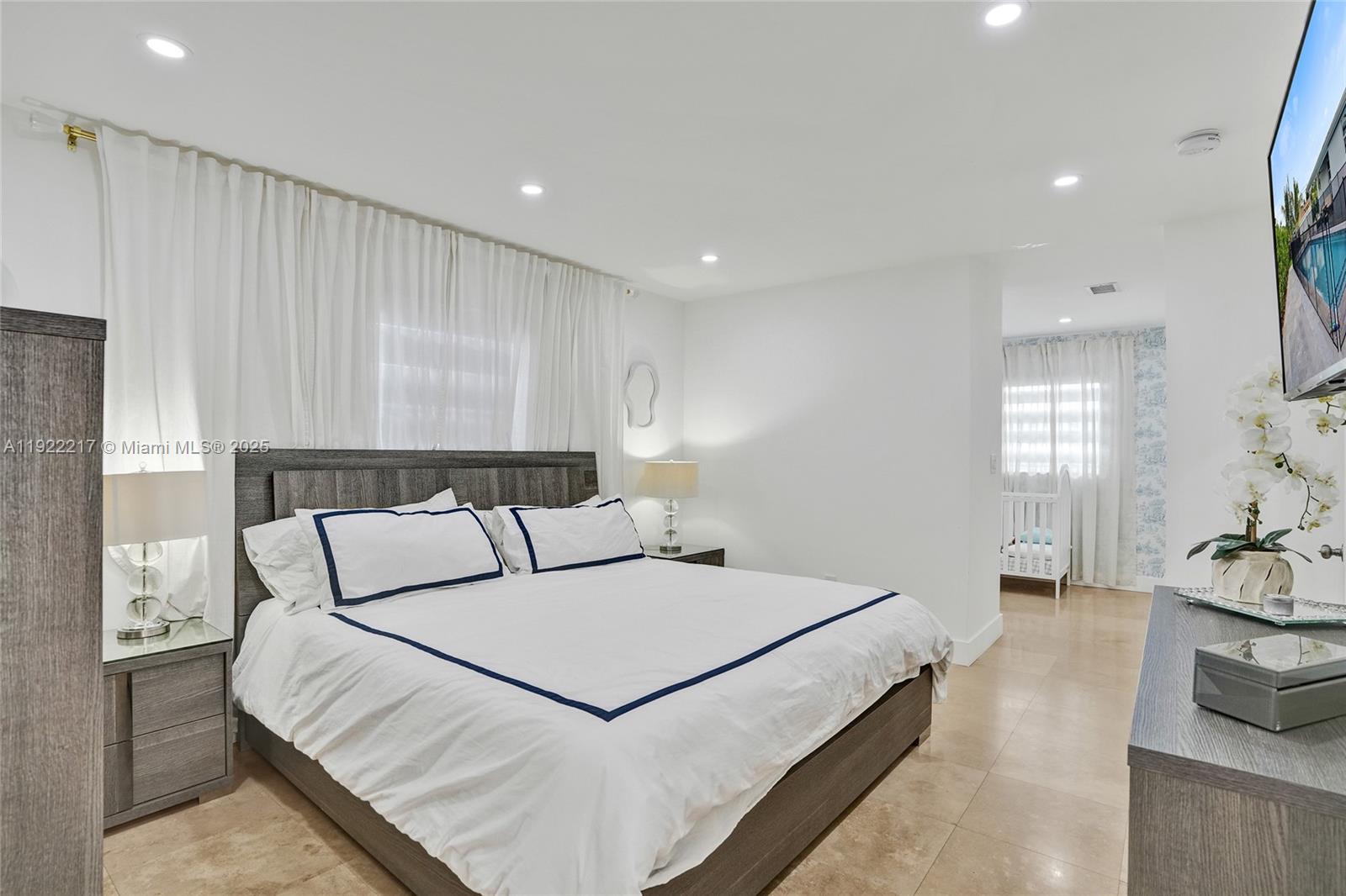 10401 Southwest 53rd Street Miami, FL 33165 - Photo 16 of 50 a bedroom with a large bed and a couch