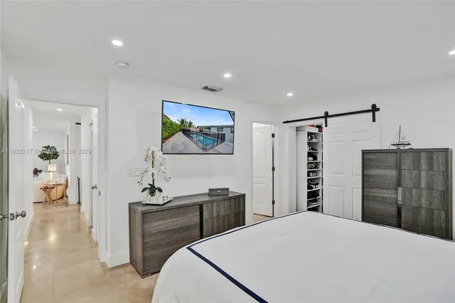 a bedroom with a bed and a cabinets