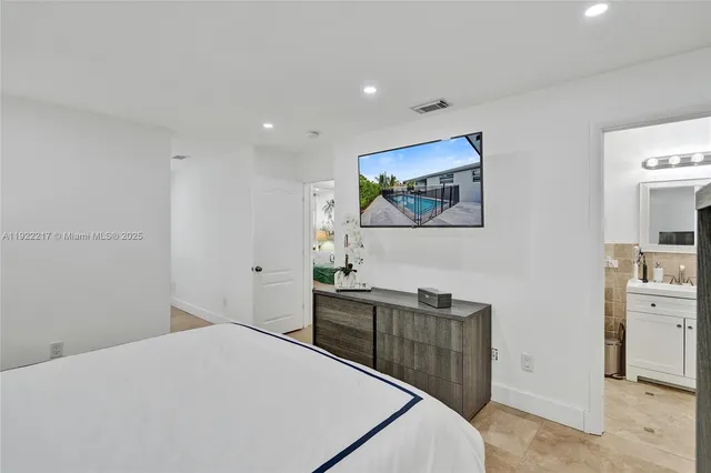 a bedroom with a bed and a cabinets