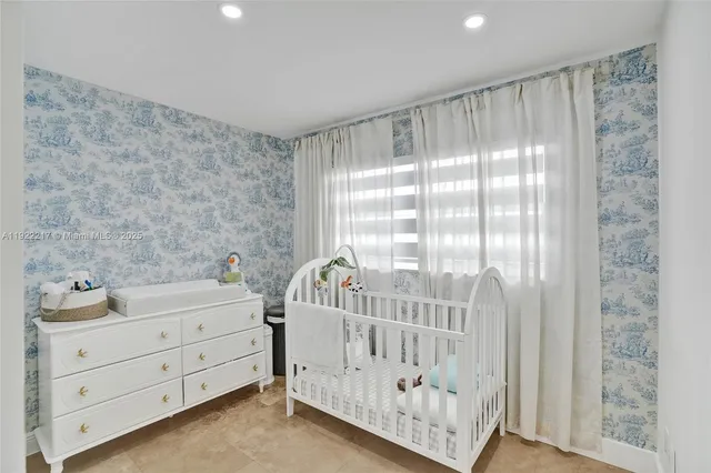 a view of a bedroom with windows