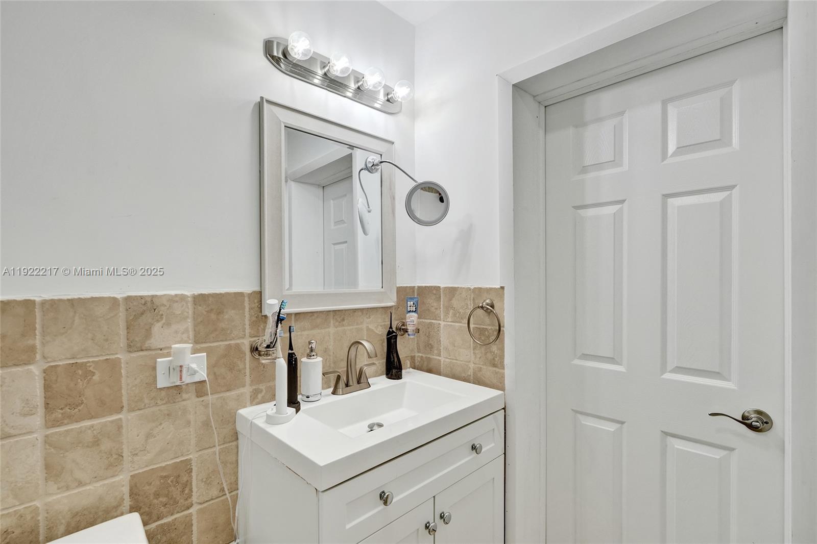 10401 Southwest 53rd Street Miami, FL 33165 - Photo 23 of 50 a bathroom with a double vanity sink mirror and