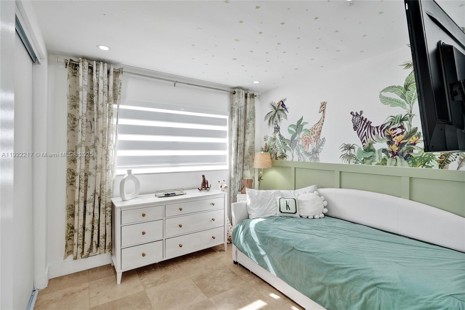 10401 Southwest 53rd Street Miami, FL 33165 - Photo 25 of 50 a bedroom with a bed and a window