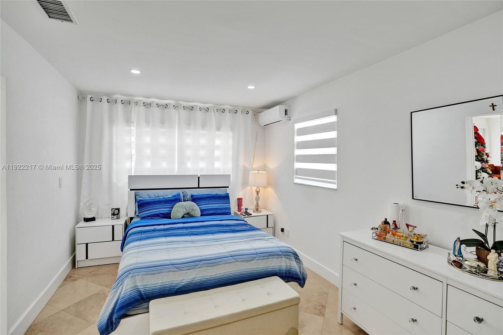 10401 Southwest 53rd Street Miami, FL 33165 - Photo 28 of 50 a bedroom with a bed and window